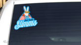 A die cut sticker applied to the back window of a vehicle